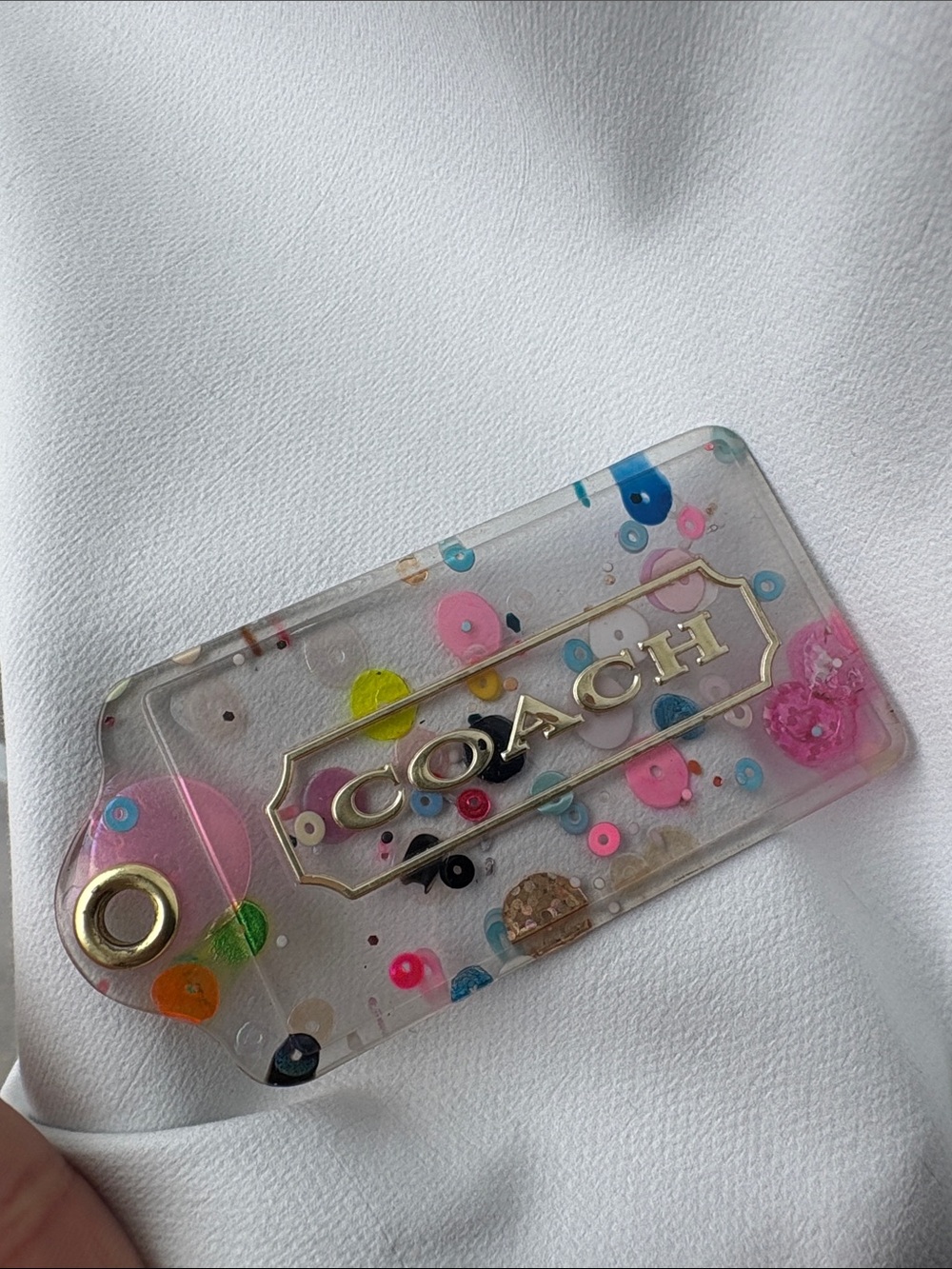 Coach Clear Confetti Hang Tag with Gold Logo